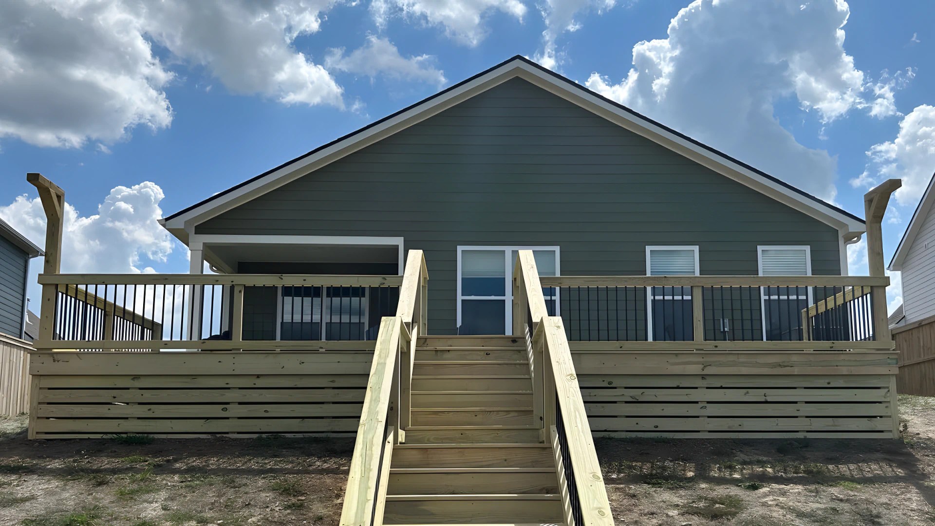 a newly constructed wooden deck for a client